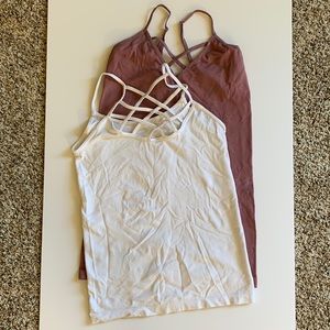 2 strappy stretchy camisoles. 1 white no tags & 1 dusty rose in OS